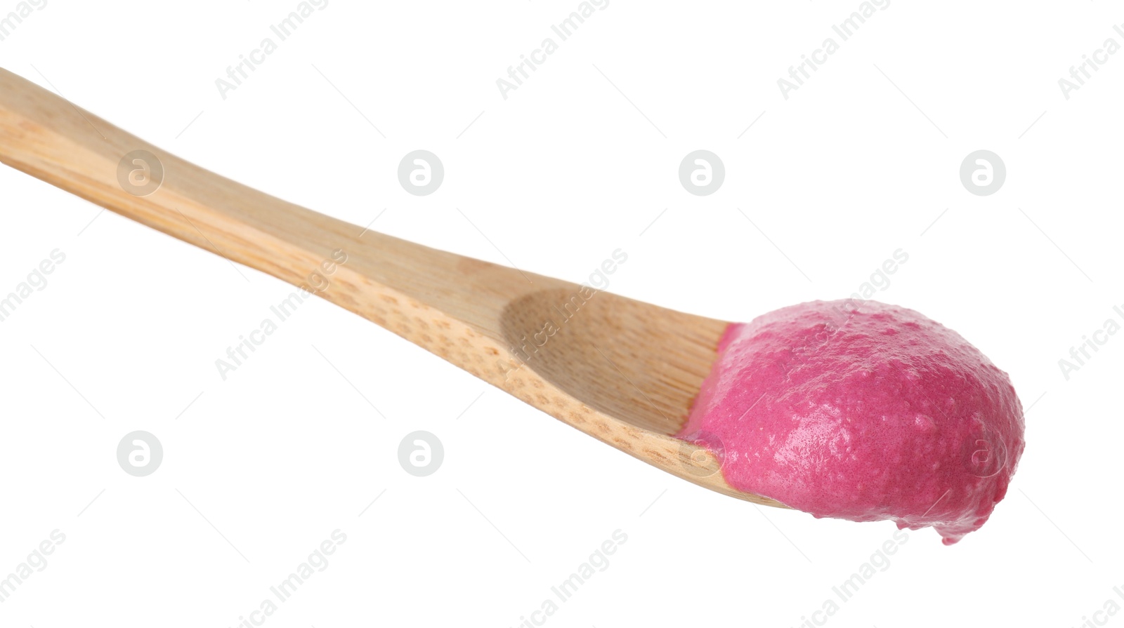 Photo of Tasty beetroot hummus in wooden spoon isolated on white