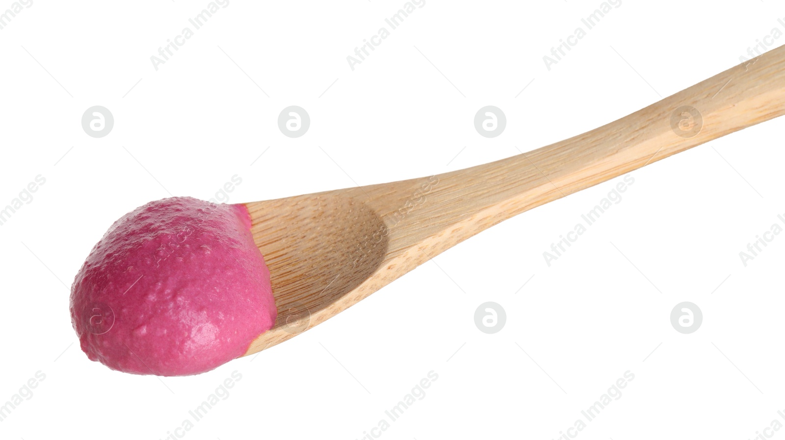 Photo of Tasty beetroot hummus in wooden spoon isolated on white