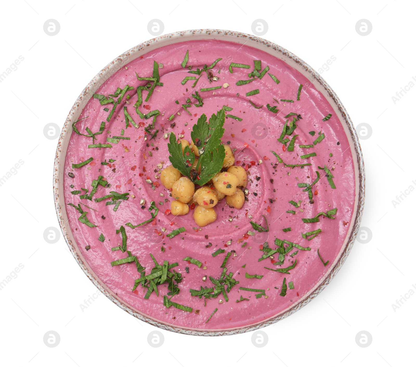 Photo of Tasty beetroot hummus and chickpeas in bowl isolated on white, top view