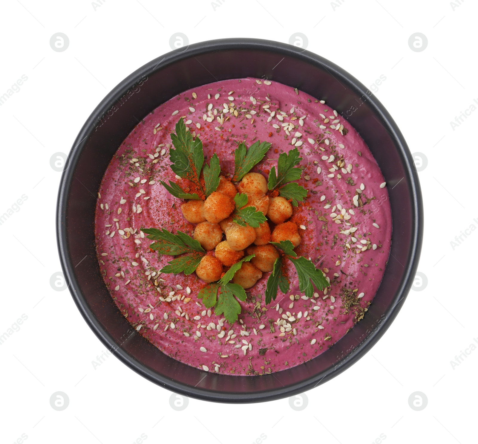 Photo of Tasty beetroot hummus and chickpeas in bowl isolated on white, top view