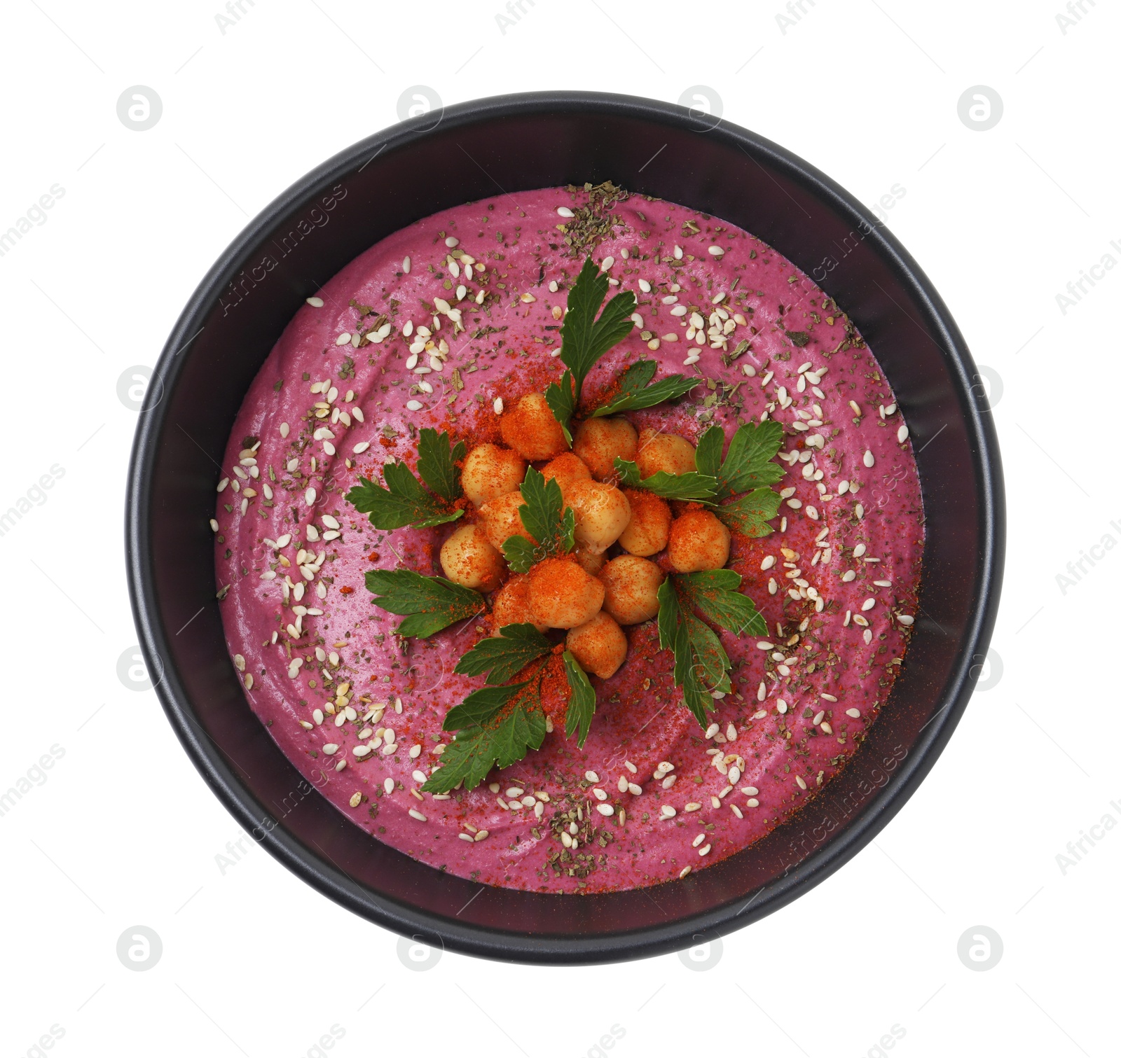 Photo of Tasty beetroot hummus and chickpeas in bowl isolated on white, top view