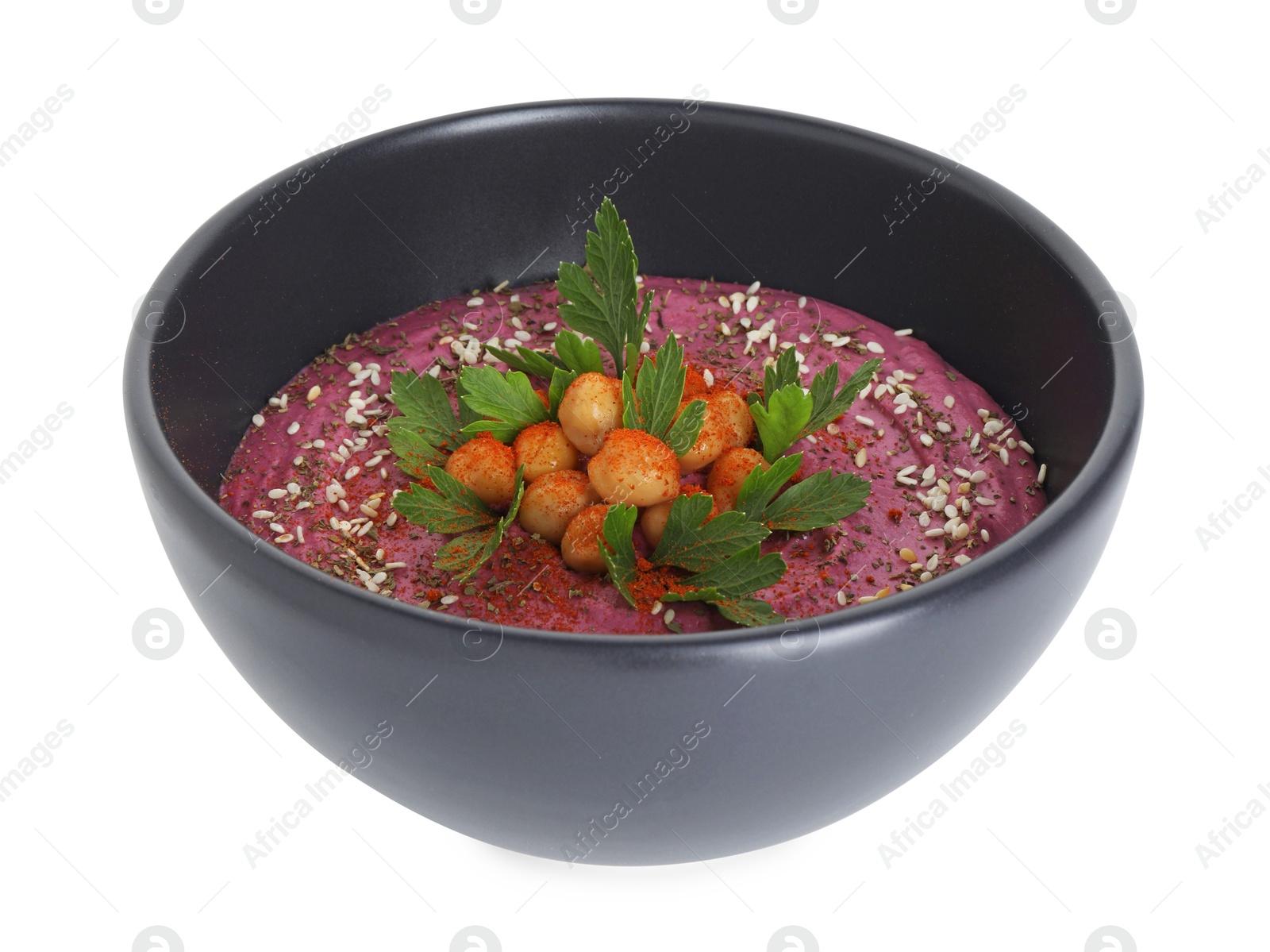 Photo of Tasty beetroot hummus and chickpeas in bowl isolated on white