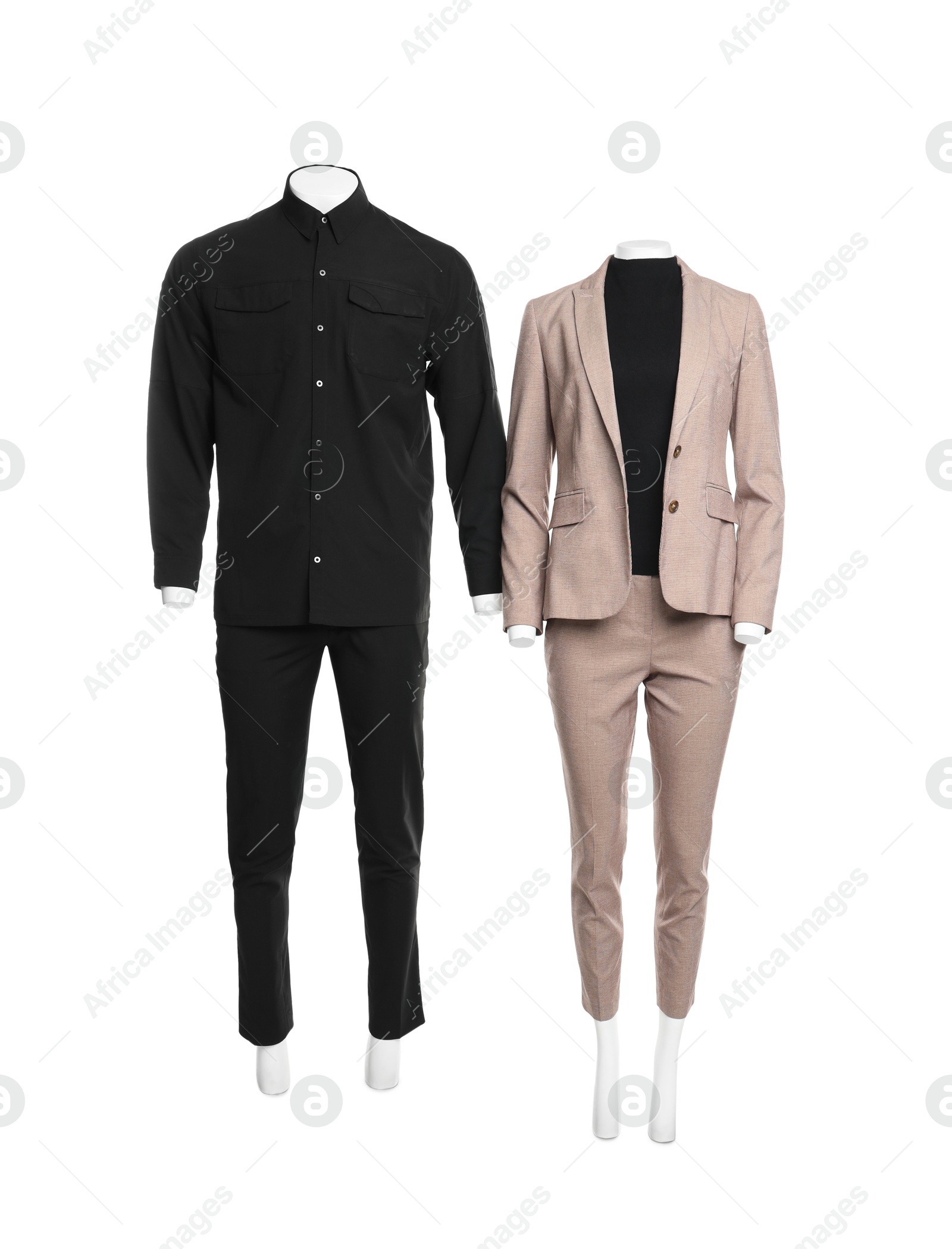 Photo of Female and male mannequins with stylish outfits isolated on white