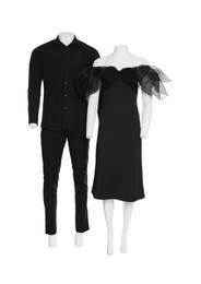 Female and male mannequins with stylish outfits isolated on white