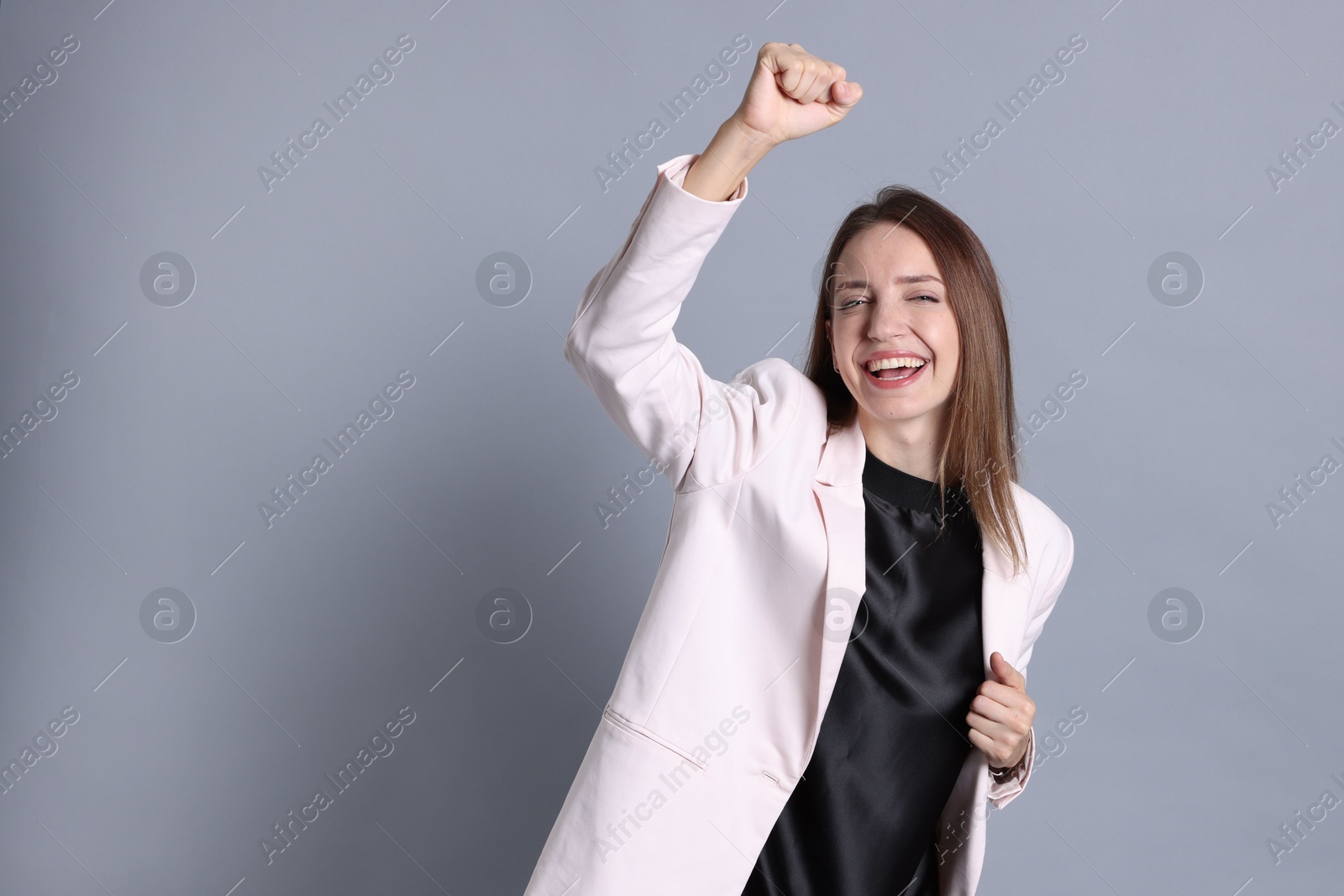 Photo of Happy winner on gray background, space for text