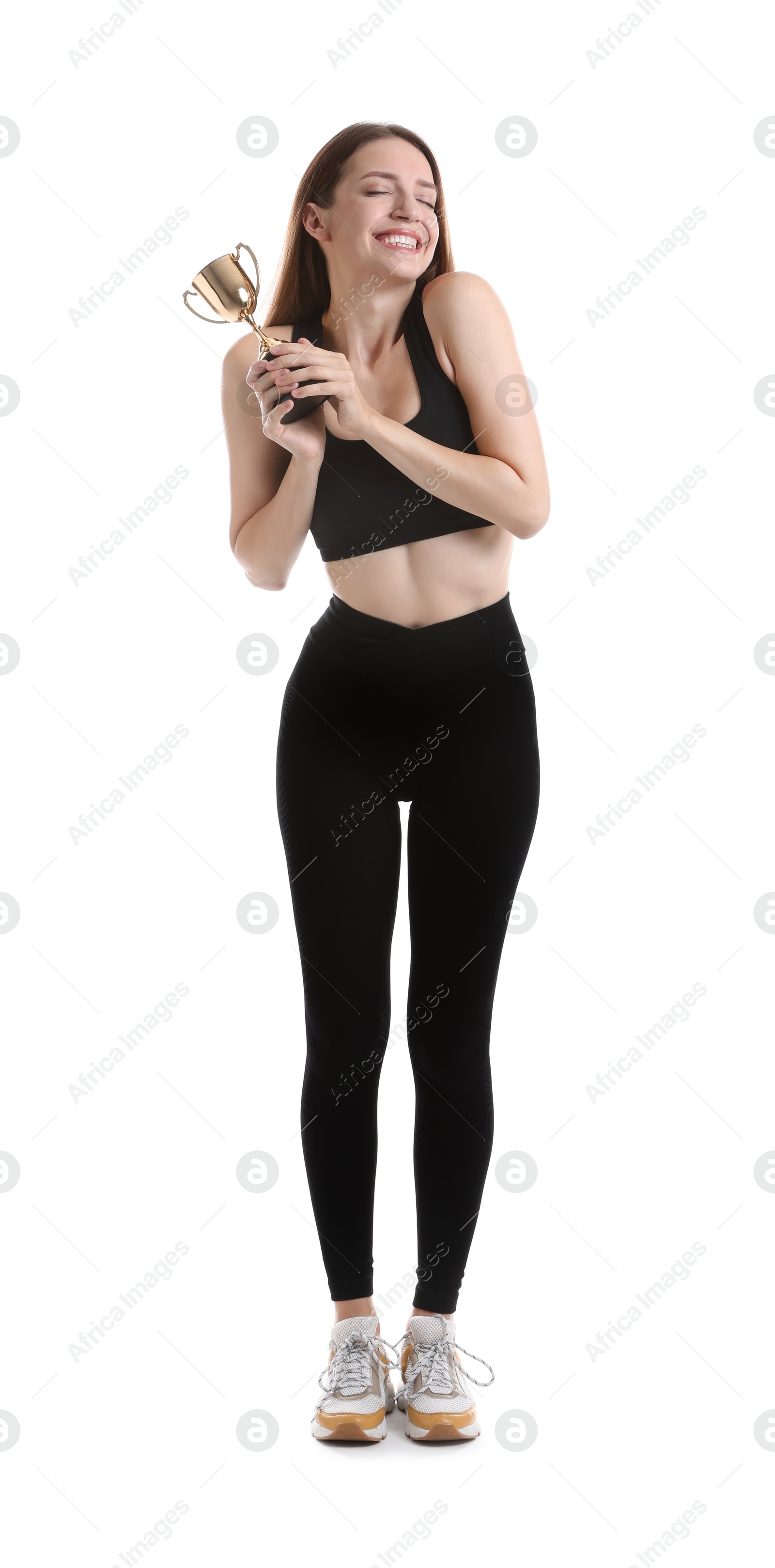 Photo of Happy winner with gold trophy cup on white background