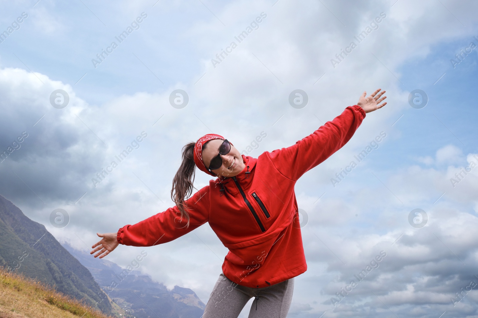 Photo of Happy young hiker in mountains. Active tourism