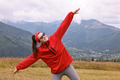 Happy young hiker in mountains. Active tourism