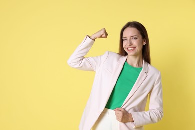 Photo of Happy winner on yellow background, space for text