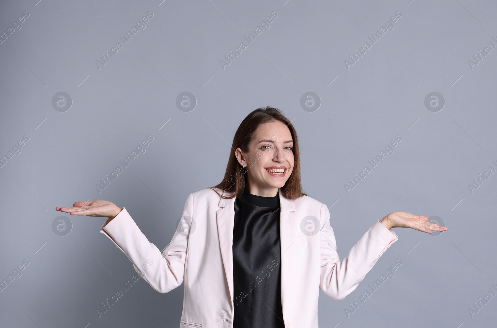 Photo of Portrait of happy winner on gray background