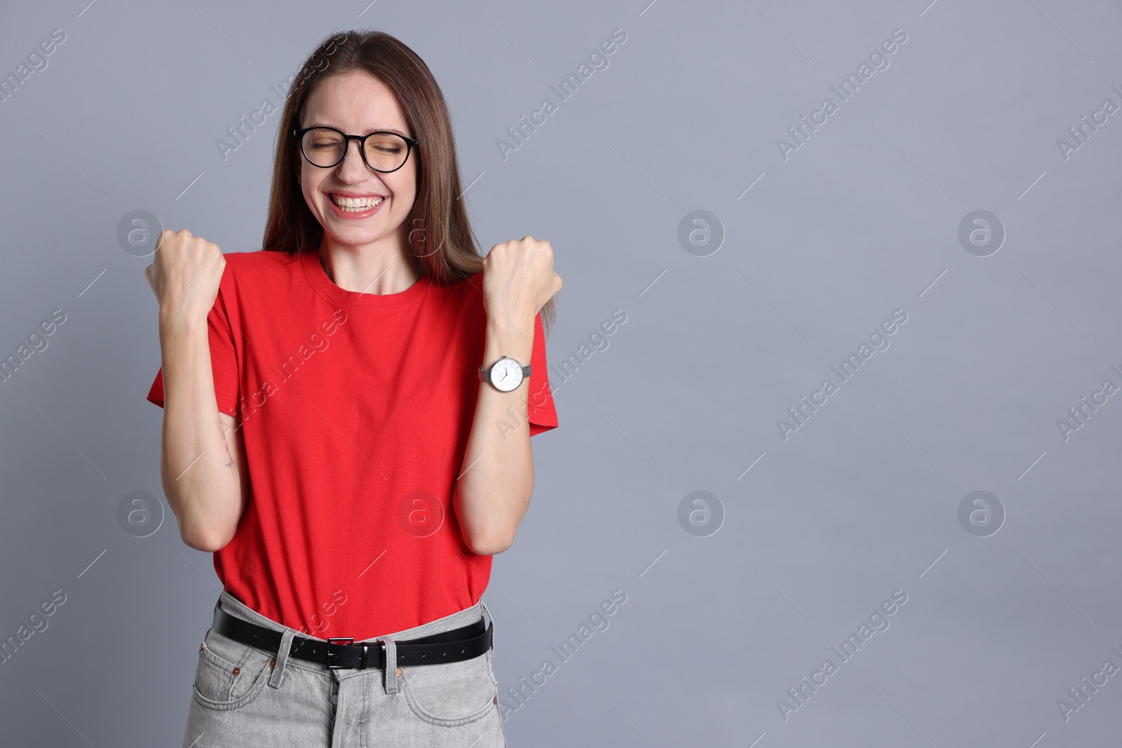 Photo of Happy winner on gray background, space for text