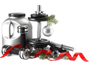 Photo of Dumbbells, container with supplement and Christmas decor isolated on white