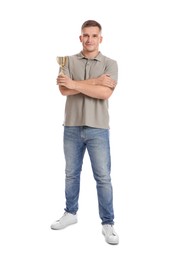 Happy winner with golden trophy cup on white background