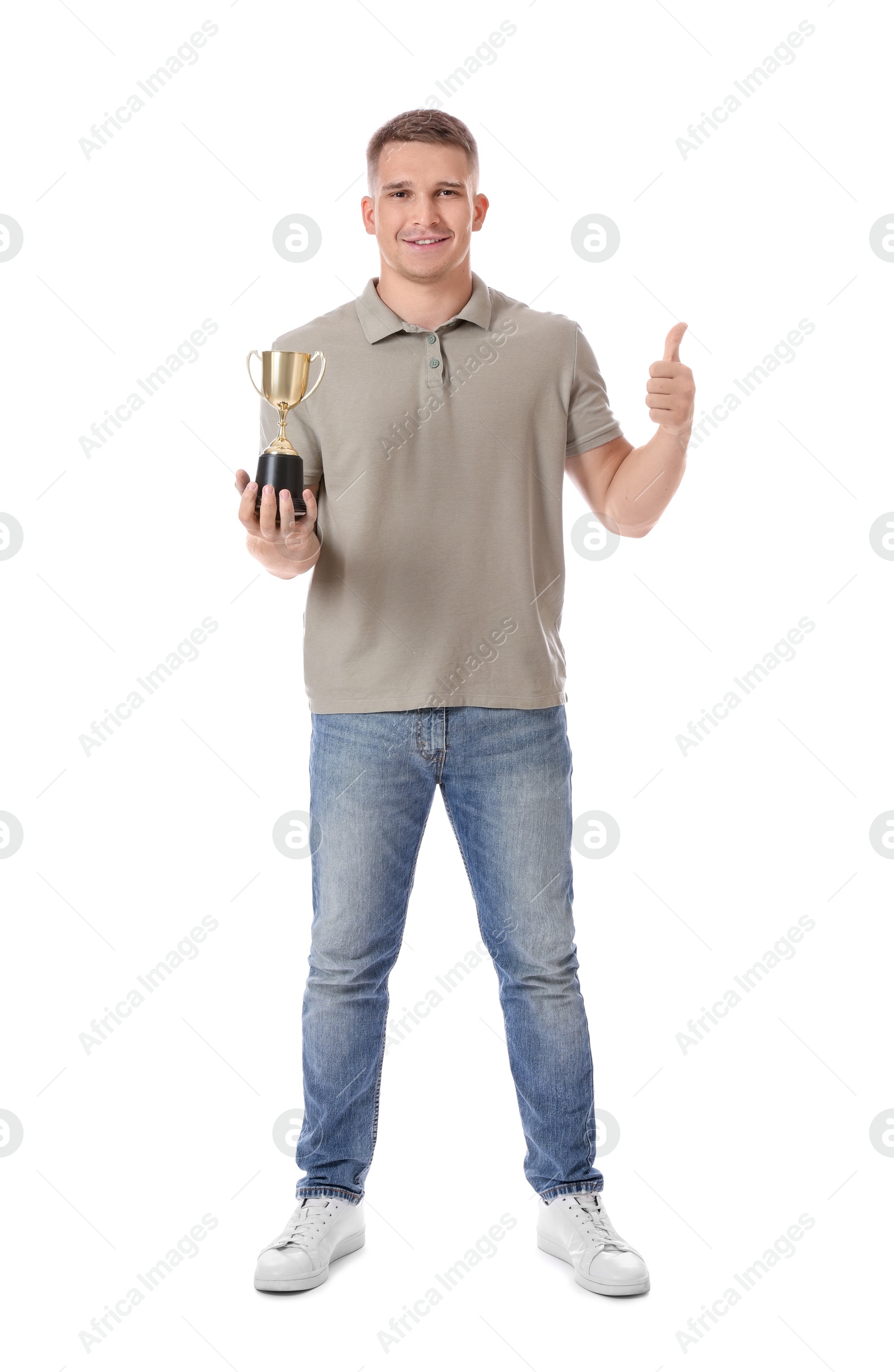 Photo of Happy winner with golden trophy cup showing thumbs up on white background