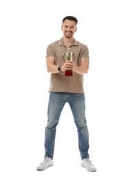 Photo of Happy winner with golden trophy cup on white background