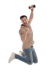 Photo of Happy winner with golden trophy cup jumping on white background