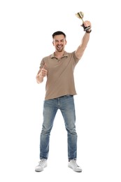 Happy winner with golden trophy cup on white background