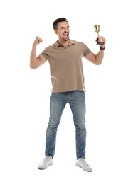 Happy winner with golden trophy cup on white background