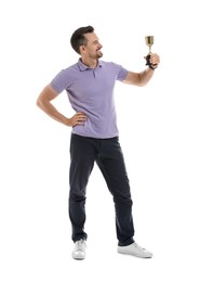 Photo of Happy winner with golden trophy cup on white background