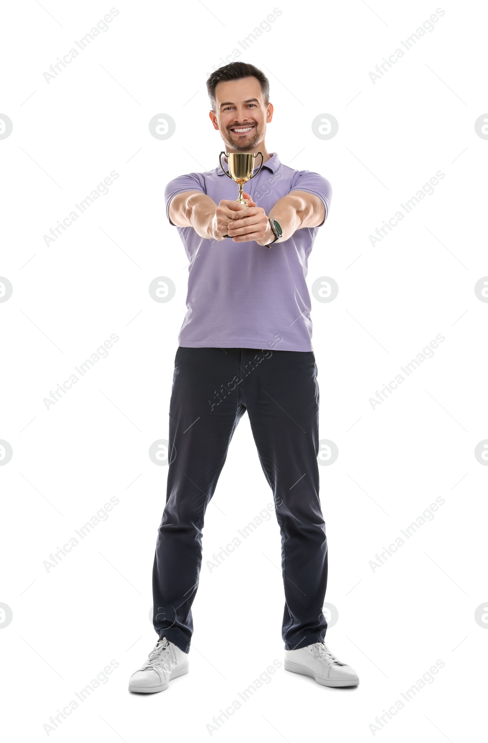 Photo of Happy winner with golden trophy cup on white background