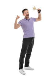 Photo of Happy winner with golden trophy cup on white background