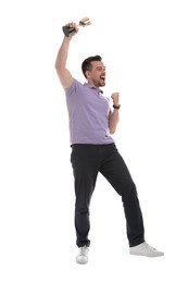 Photo of Happy winner with golden trophy cup on white background