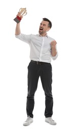 Photo of Happy winner with golden trophy cup on white background