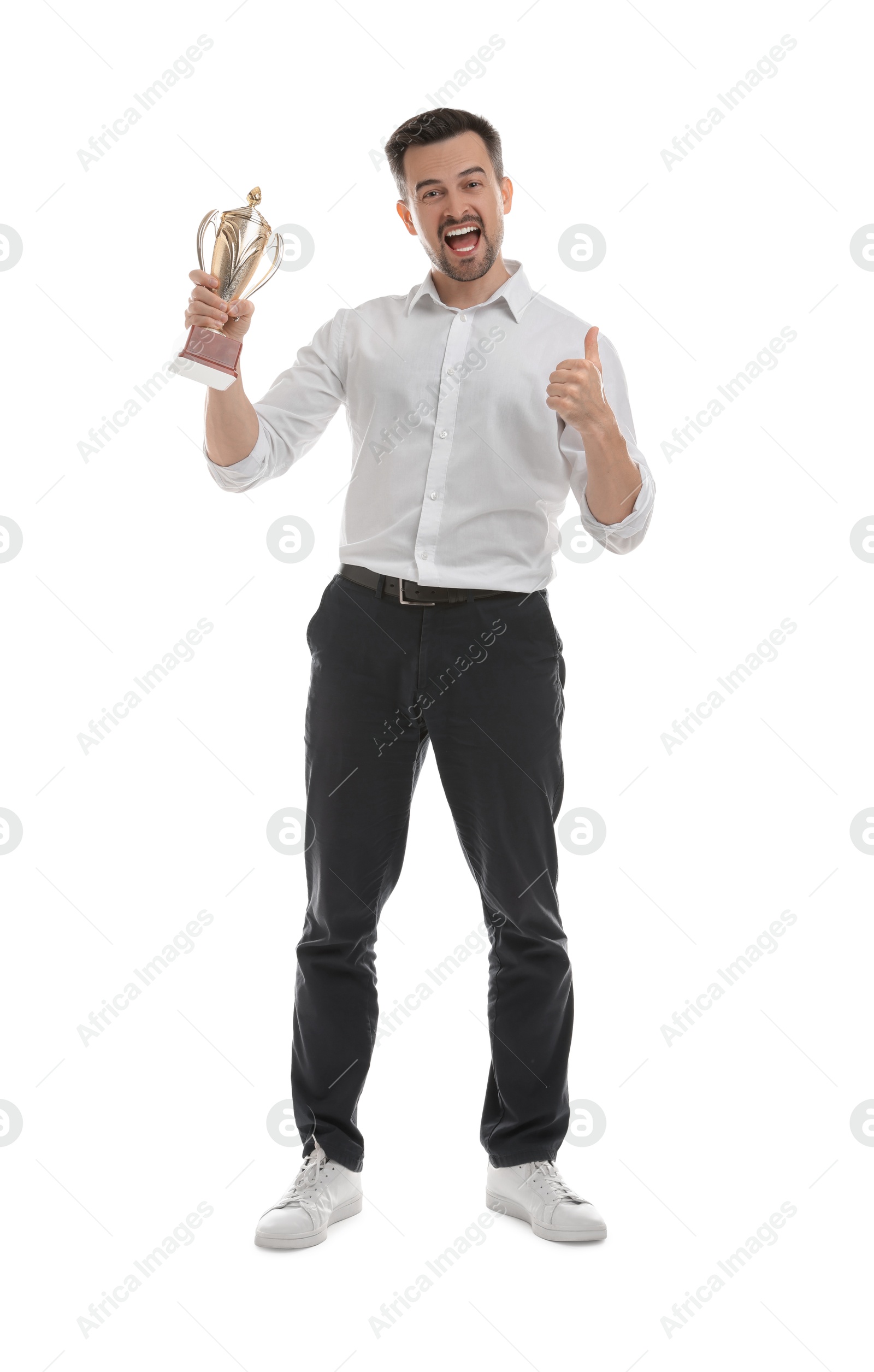 Photo of Happy winner with golden trophy cup showing thumbs up on white background