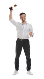 Happy winner with golden trophy cup on white background