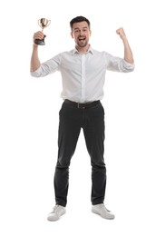 Happy winner with golden trophy cup on white background