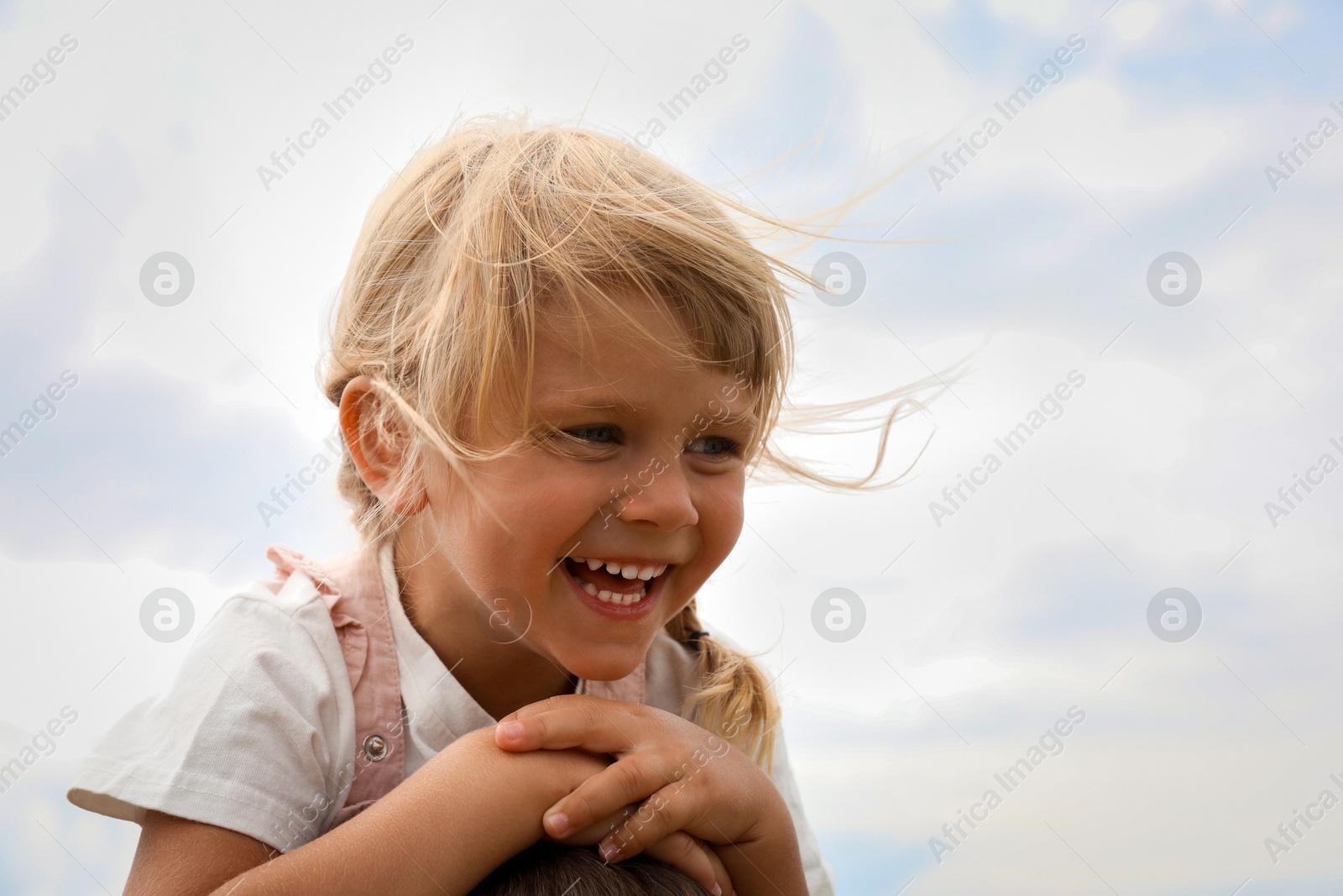 Photo of Portrait of happy little girl outdoors. Space for text