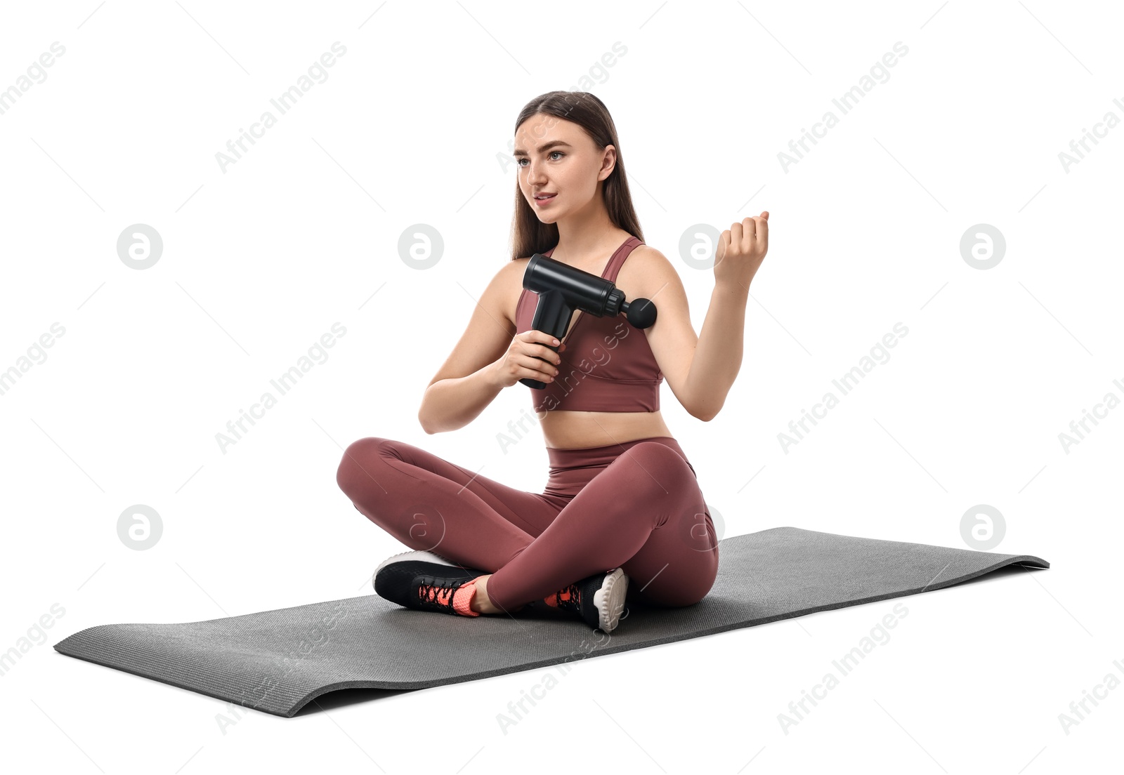 Photo of Woman using percussive massager to relieve bicep on white background