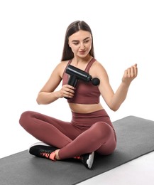 Woman using percussive massager to relieve bicep on white background