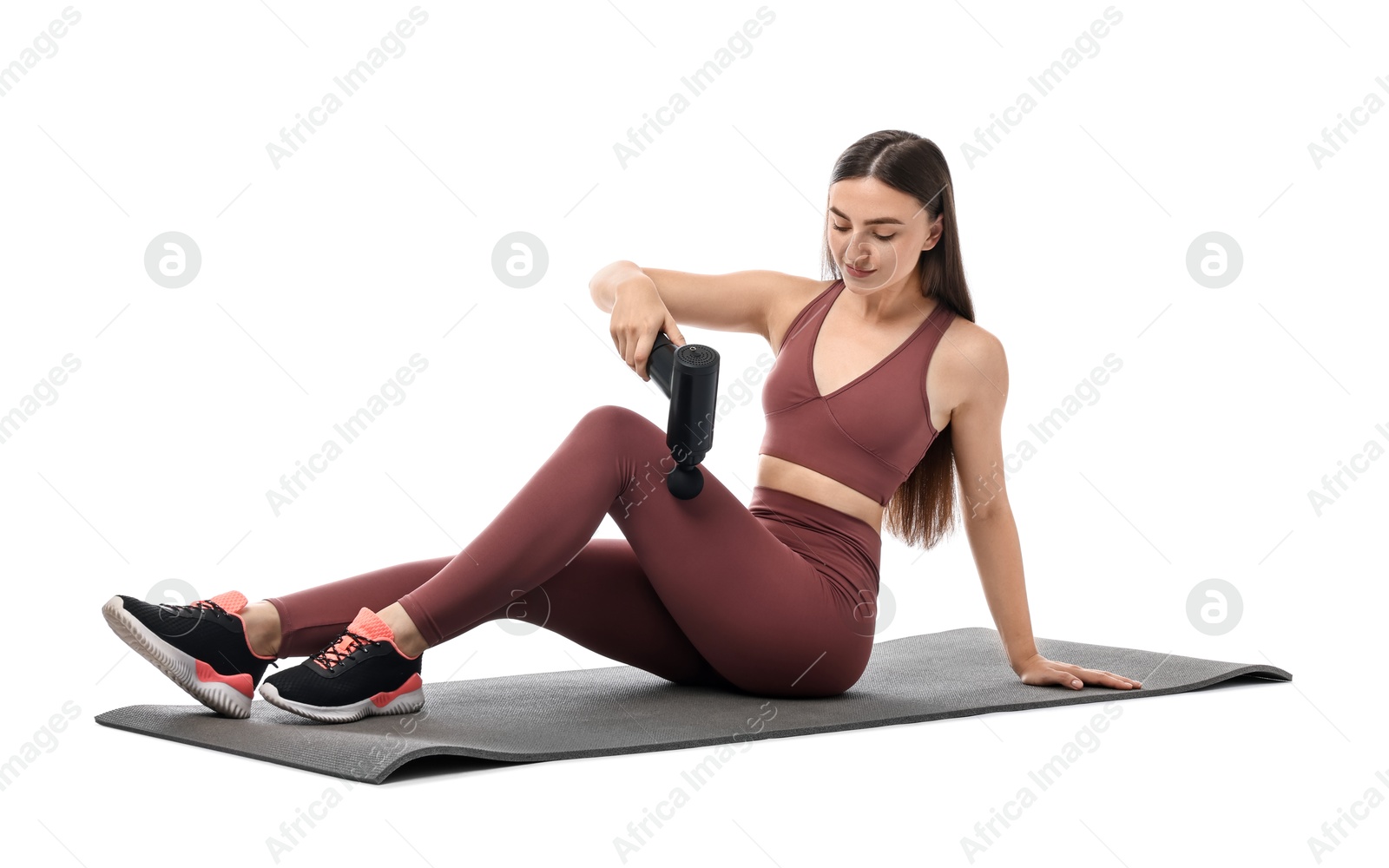 Photo of Woman using percussive massager to relieve hip muscles on white background