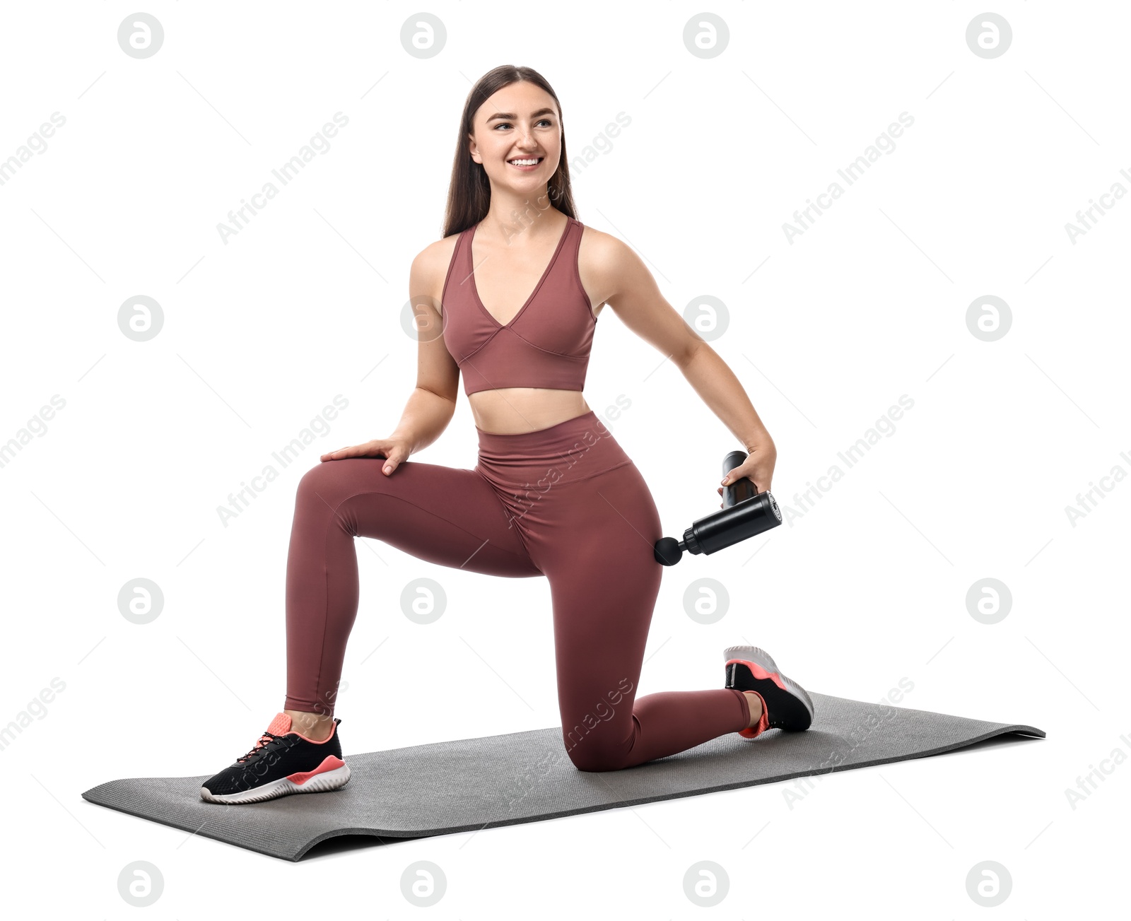 Photo of Woman using percussive massager to relieve hip muscles on white background