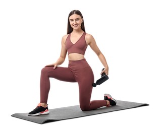 Woman using percussive massager to relieve hip muscles on white background