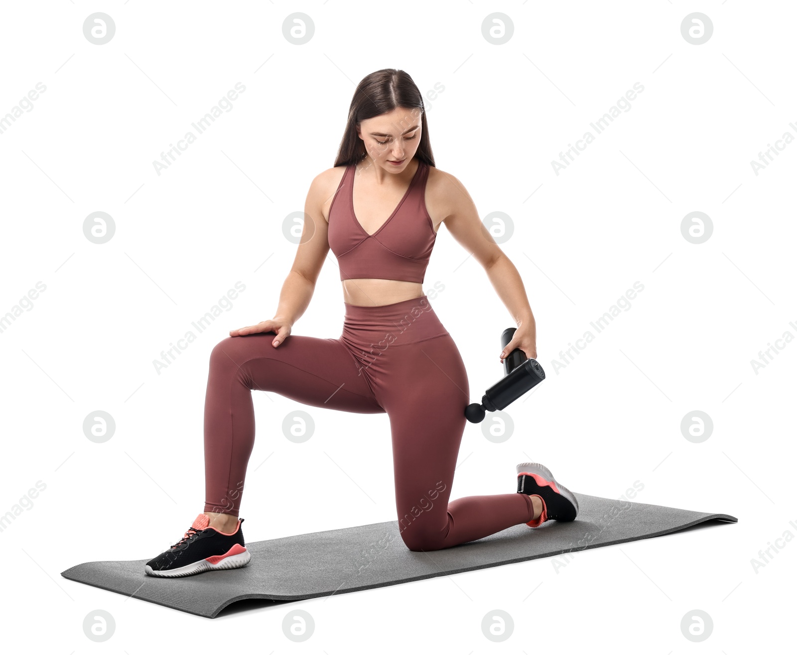 Photo of Woman using percussive massager to relieve hip muscles on white background