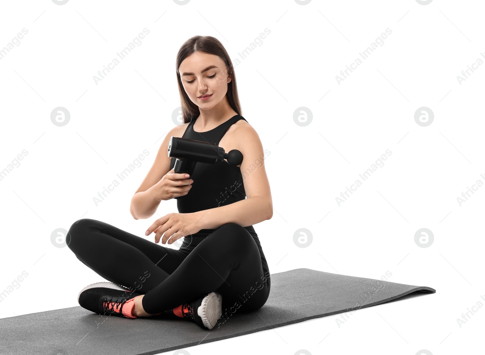 Photo of Woman using percussive massager to relieve arm muscles on white background