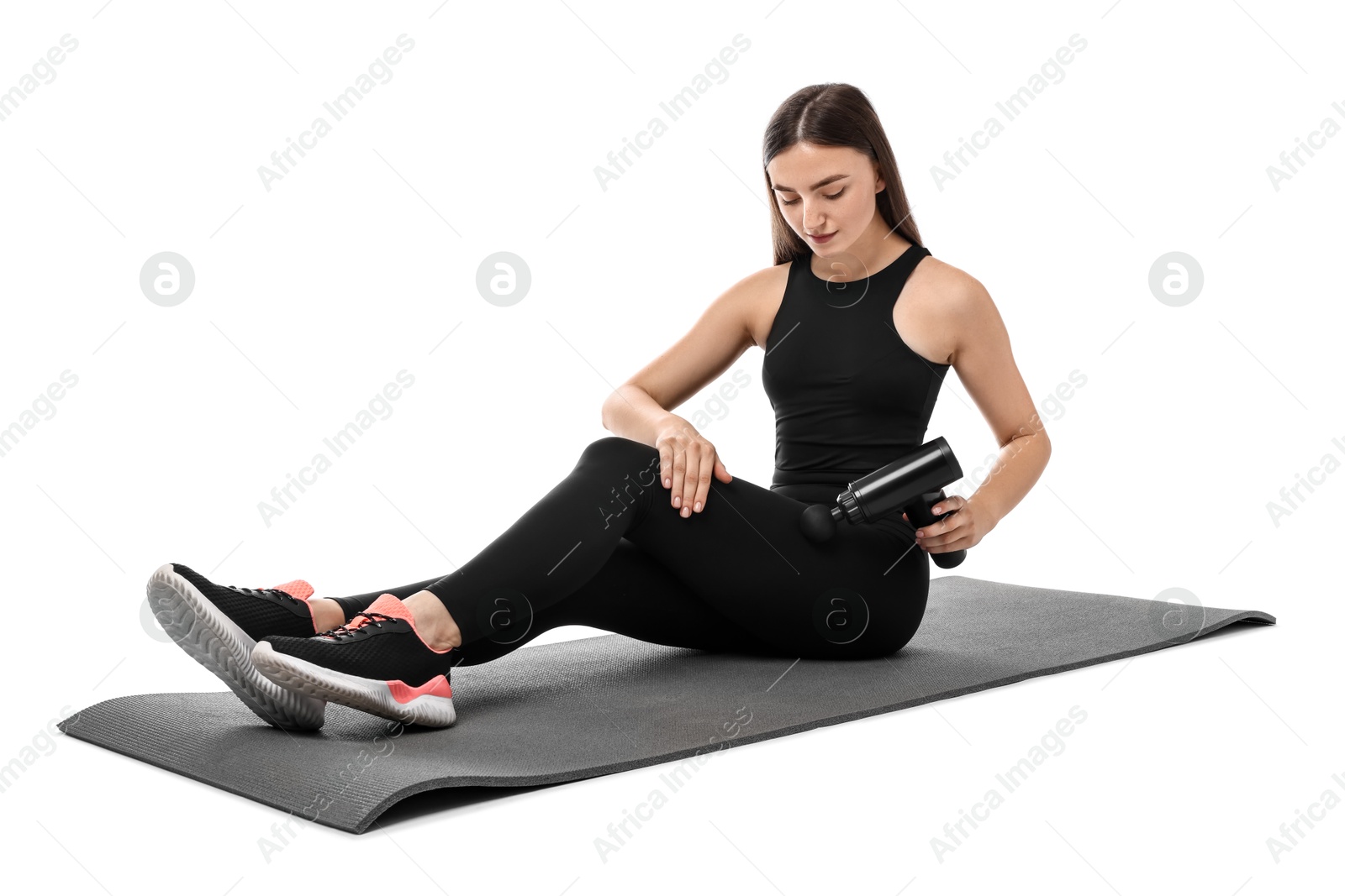 Photo of Woman using percussive massager to relieve hip muscles on white background