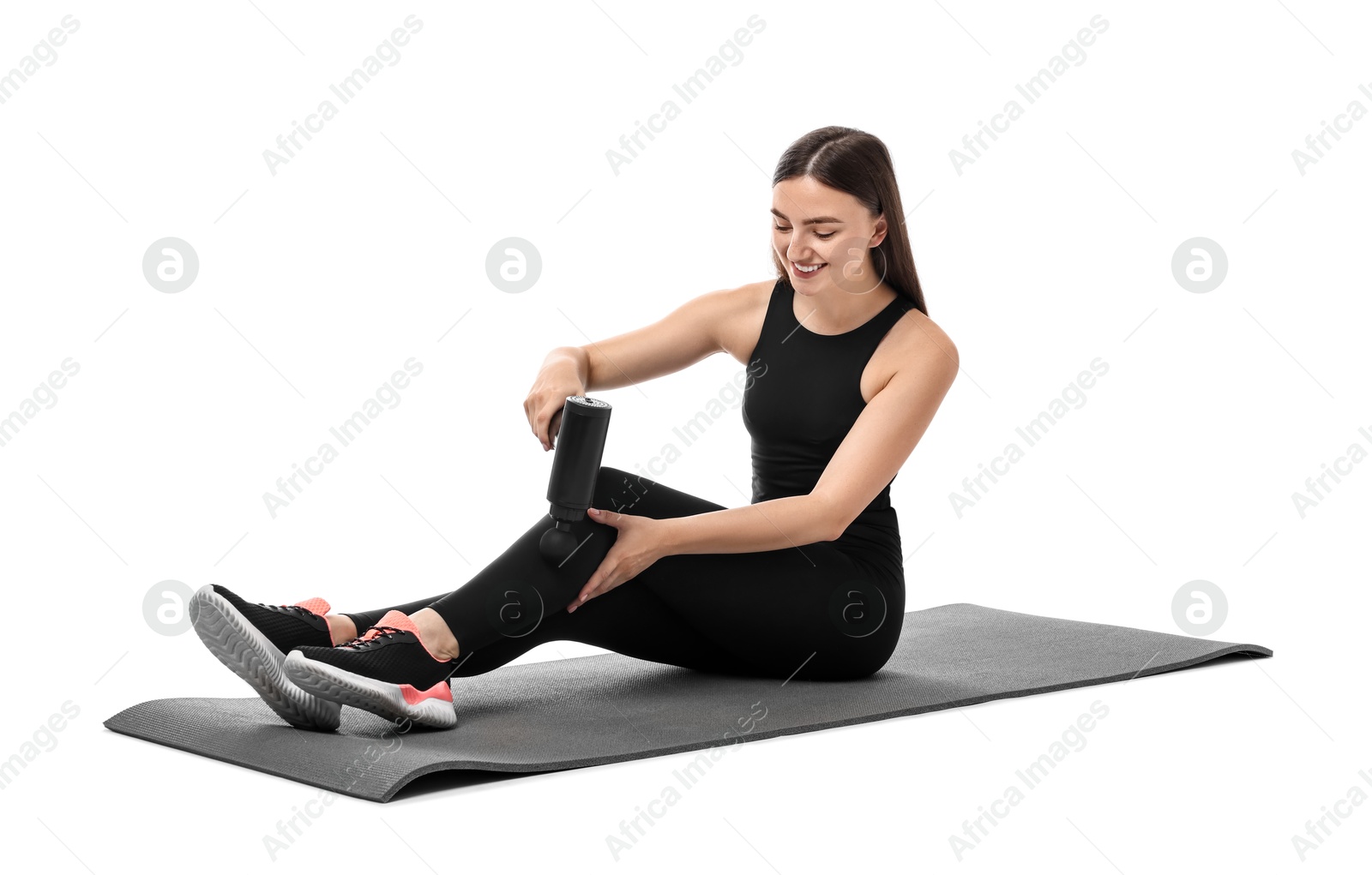 Photo of Woman using percussive massager to relieve leg muscles on white background