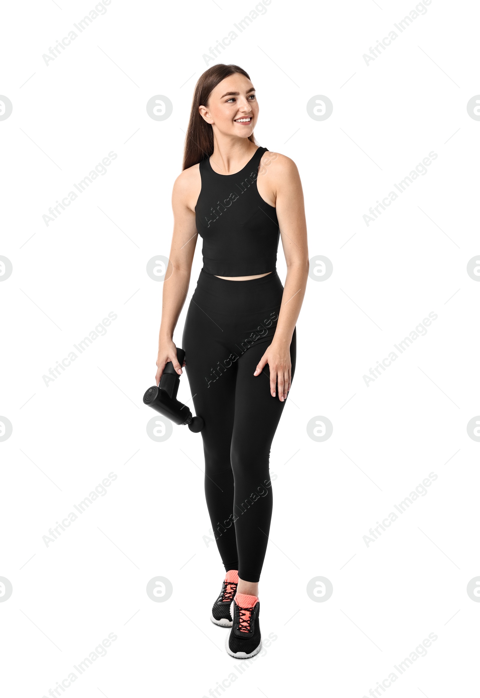 Photo of Woman using percussive massager to relieve thigh muscles on white background