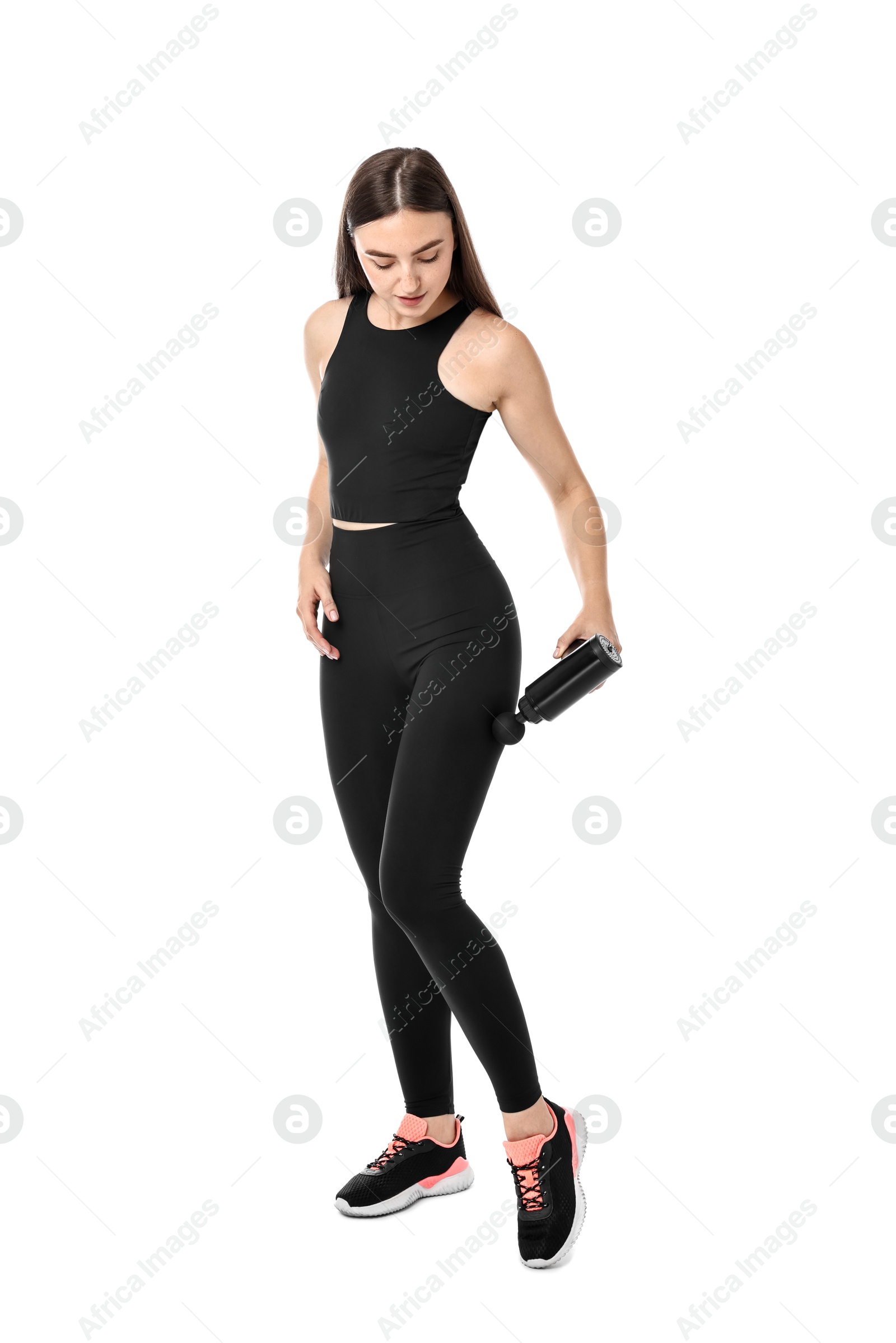 Photo of Woman using percussive massager to relieve hip muscles on white background