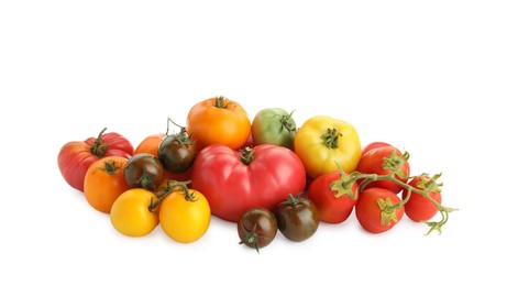 Photo of Different sorts of fresh ripe tomatoes isolated on white