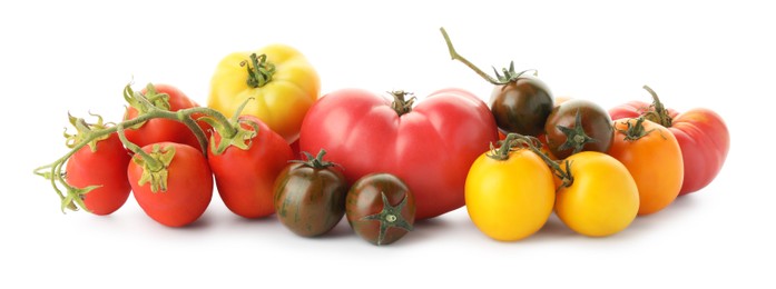 Photo of Different sorts of fresh ripe tomatoes isolated on white