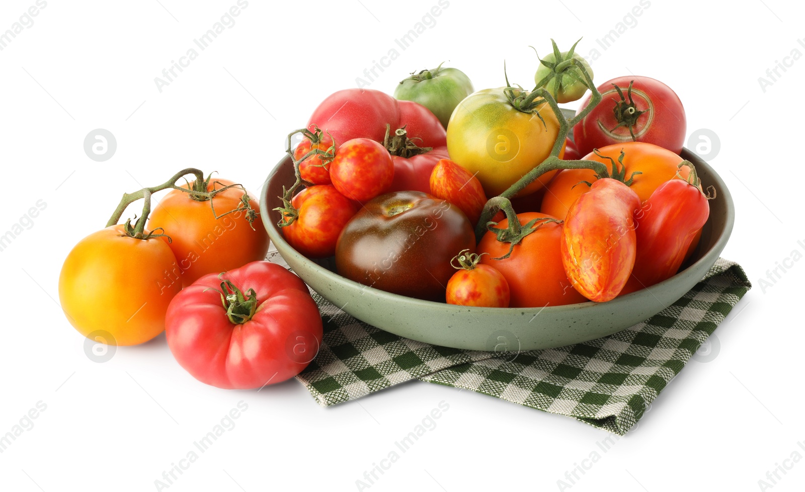 Photo of Different ripe tomatoes in bowl isolated on white