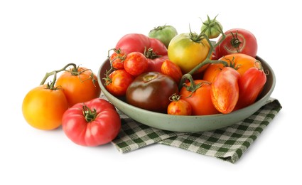 Photo of Different ripe tomatoes in bowl isolated on white