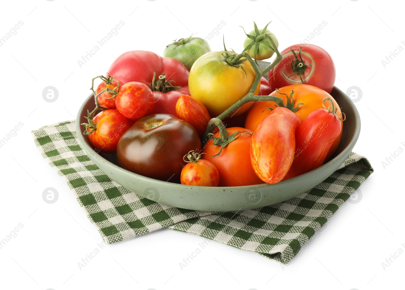 Photo of Different ripe tomatoes in bowl isolated on white