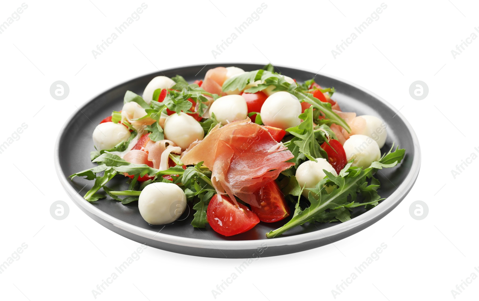 Photo of Tasty salad with arugula, mozzarella cheese, tomatoes and jamon isolated on white