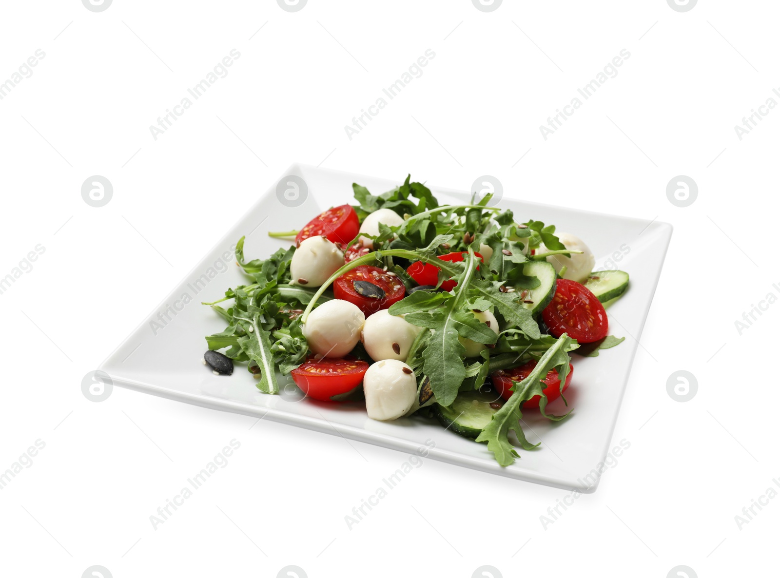 Photo of Tasty salad with arugula, mozzarella cheese and vegetables isolated on white