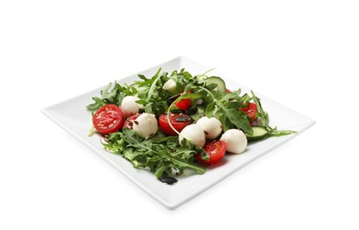 Photo of Tasty salad with arugula, mozzarella cheese and vegetables isolated on white